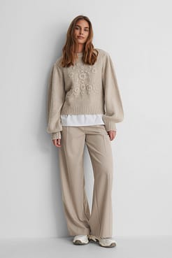 Flower Knitted Sweater with Suit Pants and Sneakers.