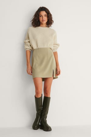 Style this mini skirt with a sweater and boots for a trendy and nice outfit. You will look so good in this!