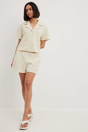 Offwhite Frottee-Shorts mit hoher Taille