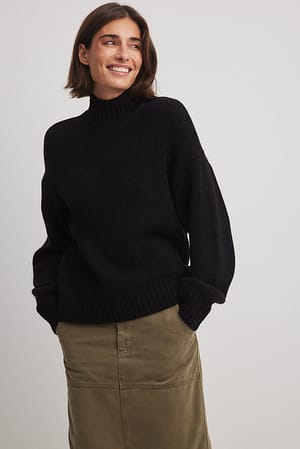 Black Strikket sweater med rullekrave
