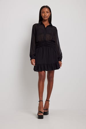 Black Mini-jurk met dobby tailledetail
